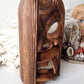 Vintage carved wooden tiki head or tribal mask statue