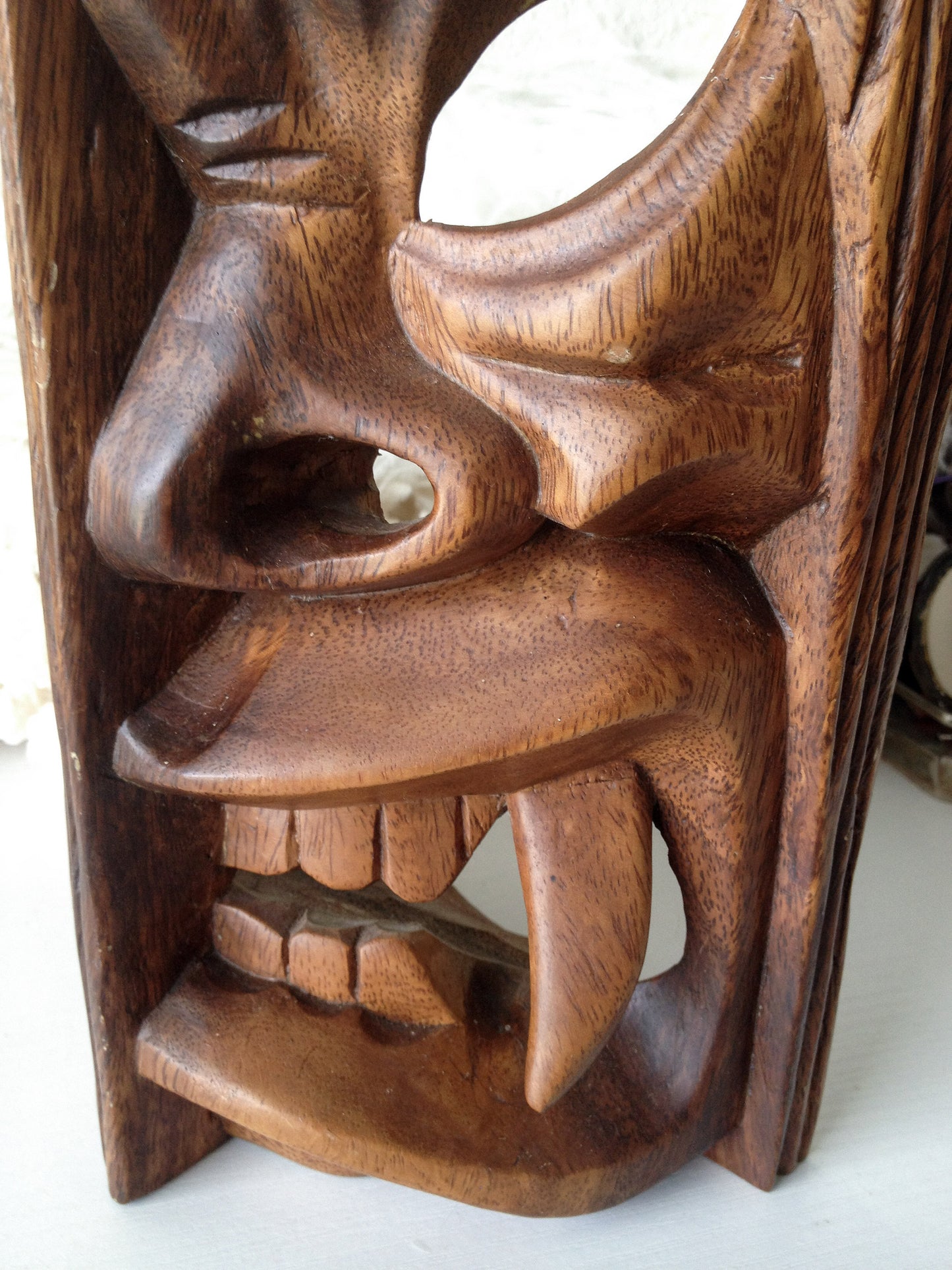 Vintage carved wooden tiki head or tribal mask statue